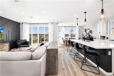 Black and white open-concept kitchen at 39463 Dayspring Way